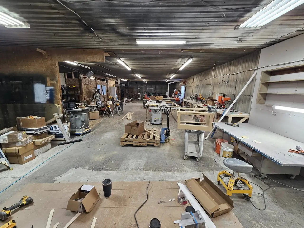 Inside the Hailey Inc cabinet shop in Guelph with work tables and cabinet parts